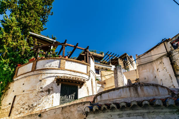 A visually striking image of a building featuring a balcony with another balcony positioned on top of it. The architecture is unique and eye-catching, showcasing a blend of modern and traditional elements. The structure appears to be multi-leveled, with intricate details and design. The balconies add depth and dimension to the building, creating a sense of grandeur and elegance. The overall composition is aesthetically pleasing, with a focus on the architectural beauty of the building. This image would be a great addition to a dataset focusing on unique building designs and architectural features.