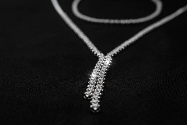 istock Dazzling Diamond Necklace with Sparkling Stones on Black Fabric 2177500829