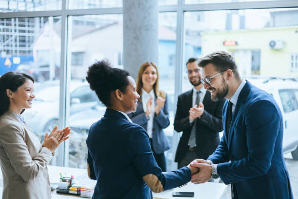 istock Handshake and applause in a corporate meeting 2177508049