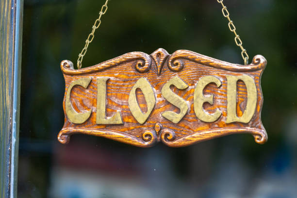 istock Vintage closed sign hanging on door 2177509430