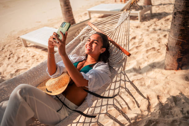 istock Hispanic Woman Enjoying Beach Vacation Selfie 2177510004