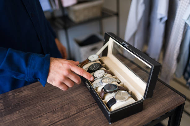 istock Man selecting the perfect wristwatch from a case while getting ready in the morning 2177510437