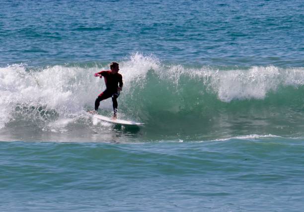 istock Surfer Races to Get around the Breaking Section of a Wave 2177512684