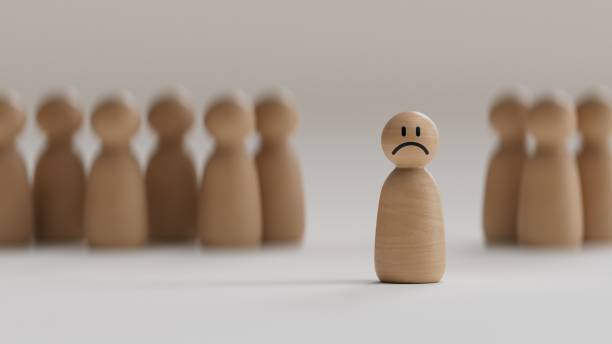 istock Sad wooden figure standing out from the crowd.3D rendering on black background. 2177515922