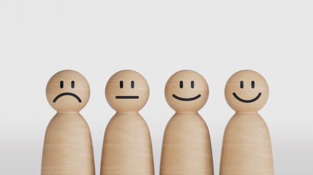 istock Wooden doll figures with emotion face. Customer evaluation and satisfaction concept.3D rendering on black background. 2177516056