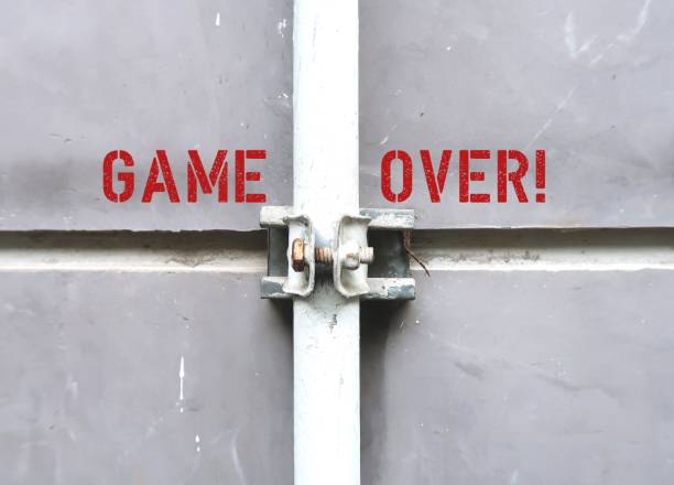 istock Grey copy space wall with red text GAME OVER - to said when a situation is regarded as hopeless or irreversible - something come to an end and in a way unsatisfactory or unsuccessful 2177518417