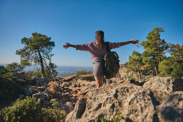 istock Hiker embracing nature on a rocky mountain trail 2177519923