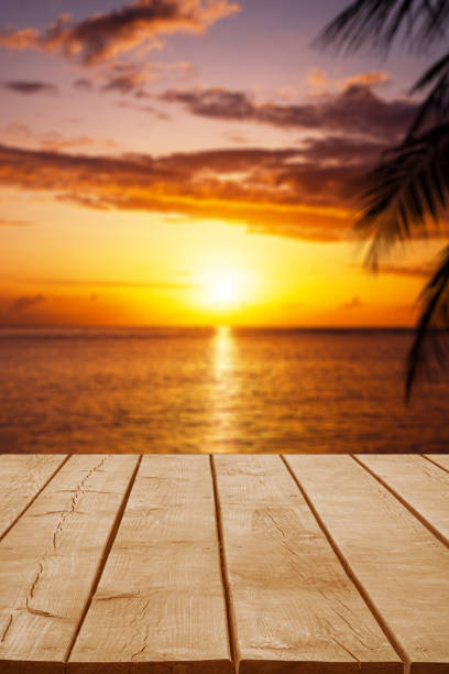 istock Empty wooden table top with tropical ocean sunrise background 2177530282