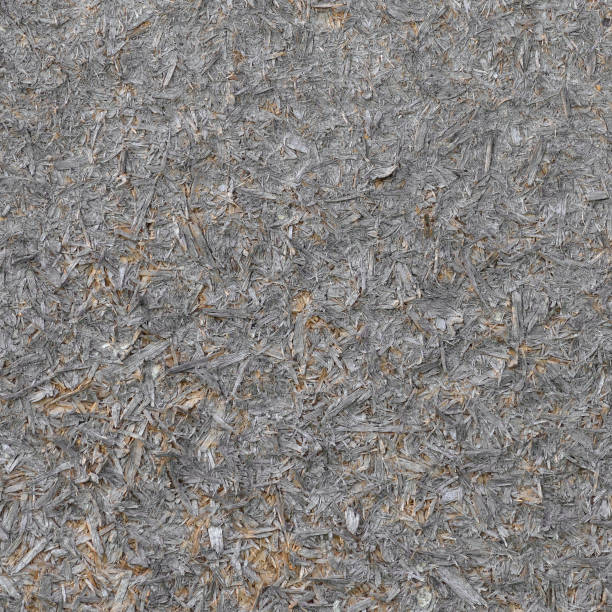 istock Old natural aged weathered oriented strand board OSB chipboard texture, grungy grey horizontal pattern, vertical rustic macro closeup, large detailed dark textured grunge ruined wooden background copy space, black, taupe, tan, brown, yellow beige detail 2177530612