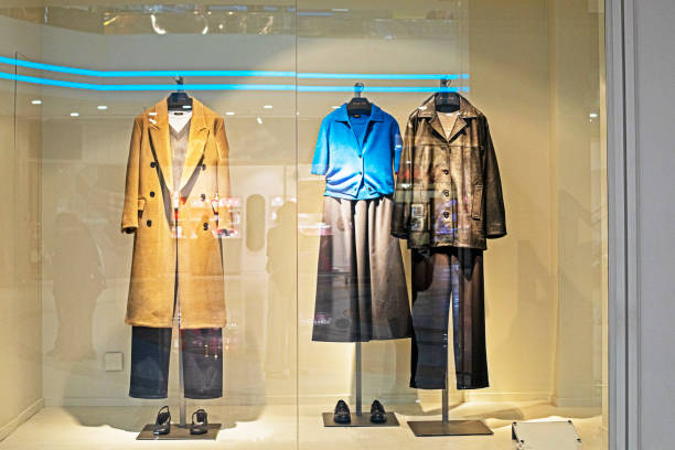 istock stylish men's and women's outerwear on mannequins 2177535744