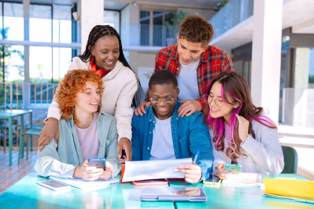 istock Happy diverse group of students studying in the library 2177538508