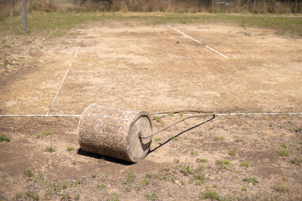 An old style concrete roller on an abandoned granite gravel base tennis court in New South Wales, Australia