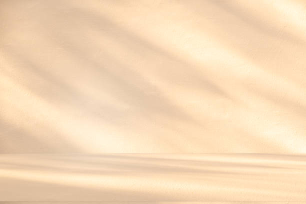 istock Studio style background wall decoration presentation uses white and beige tones. with shadows cast from a nearby window, concept creating a decorative 2177539457