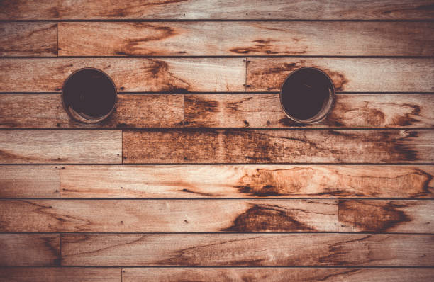 Brown wooden wall texture with portholes. Vintage rustic background
