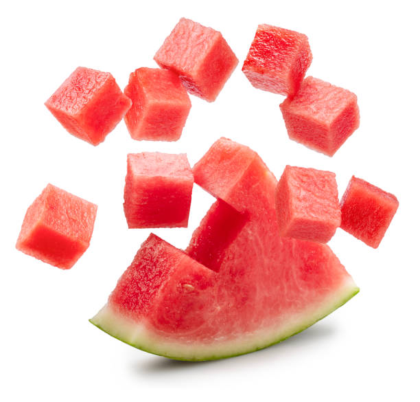 istock Watermelon triangle piece  and watermelon cubes levitating in air on it isolated on white background. File contains clipping paths. 2177546391