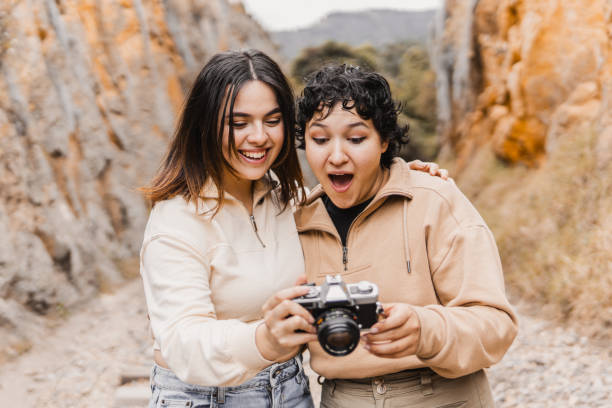 istock Surprised friends looking at camera screen in canyon setting 2177547413