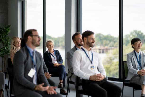 istock Engaged audience attentively listens during a business presentation. 2177550150