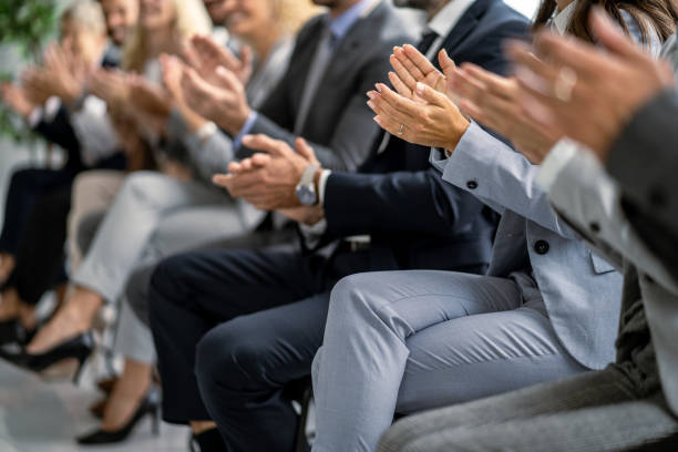 istock Audience applauding enthusiastically at captivating business presentation. 2177550208
