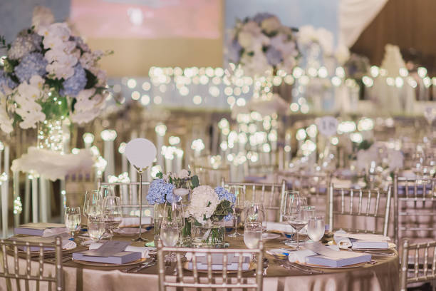 istock luxury color theme wedding solemnisation dinner flower florist , dinnerware banquet, cloth and stage lighting decoration design in premium hotel ballroom and beautiful beach event 2177550983