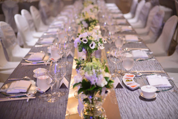 istock luxury color theme wedding solemnisation dinner flower florist , dinnerware banquet, cloth and stage lighting decoration design in premium hotel ballroom and beautiful beach event 2177551021