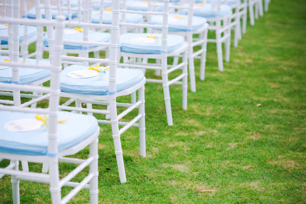 luxury color theme wedding solemnisation dinner flower florist , dinnerware banquet, cloth and stage lighting decoration design in premium hotel ballroom and beautiful beach event