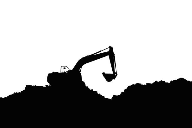 Excavator loading dumper truck on mining site