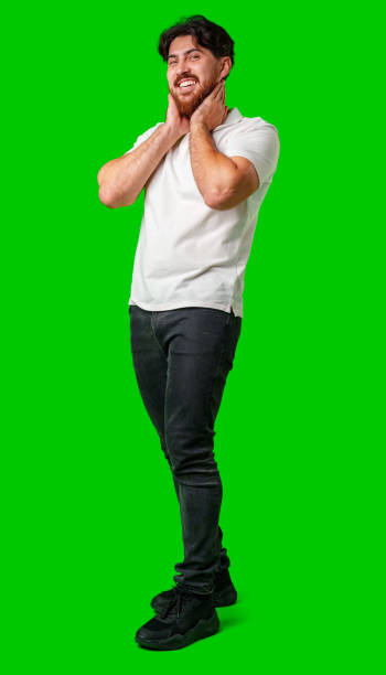 istock A man with a beard smiles confidently against a bright green background 2177552813