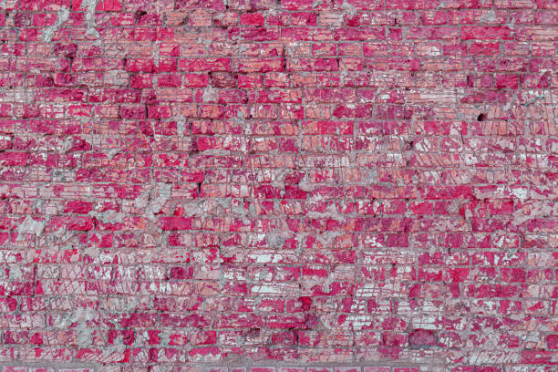 Texture of an old pink brick wall. Abstract construction background.