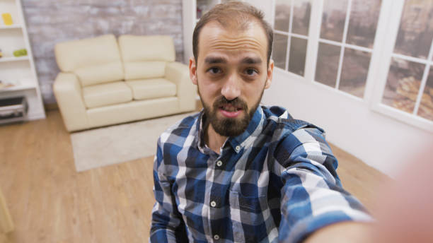 istock Young influencer talking with the camera while recording a vlog 2177555600