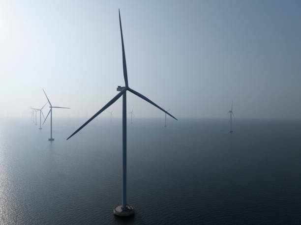 istock Wind turbines in an offshore wind park producing electricity 2177557104