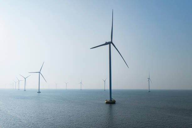istock Wind turbines in an offshore wind park producing electricity 2177557408