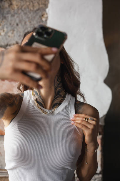 Woman Taking a Picture With Her Cell Phone
