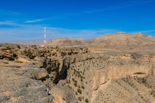istock Stunning view of Oman's rugged terrain showcasing a distant communication tower under a clear sky 2177557657