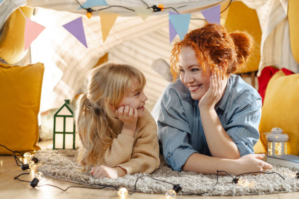 istock Mother and daughter sharing a joyful moment in cozy home setting 2177560972
