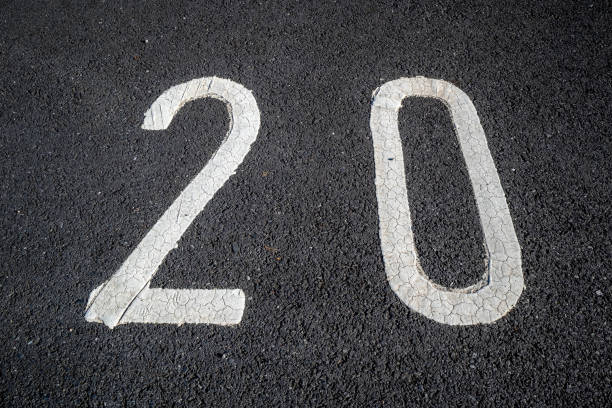 istock Number twenty 20 painted in white on tarmac 2177562121