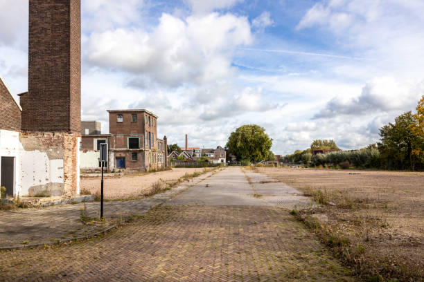 A few old industrial buildings remain on a site where space has been made for new construction