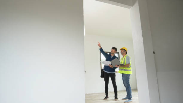 istock Asian male engineer explaining structure and strength to Asian man who is interested in buying a house. Home project concept for strength and structural standards. 2177568967