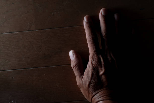 istock Male palm on a dark background 2177573843