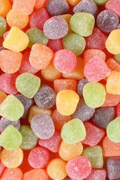 colorful candies and sweets in jars close up