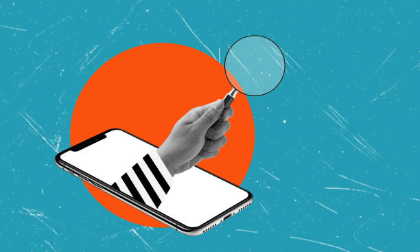 istock Modern art collage depicting scammer's hand with a magnifying glass from a cell phone on a blue background. 2177580636