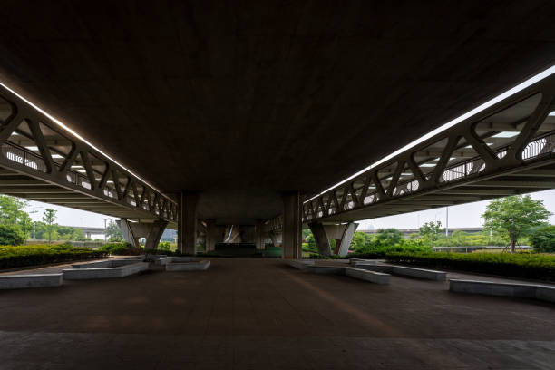 Concrete structure and asphalt road space under the overpass in the city