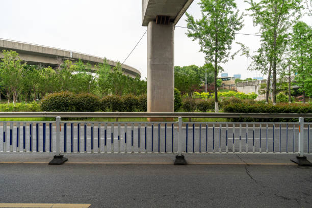 Concrete structure and asphalt road space under the overpass in the city