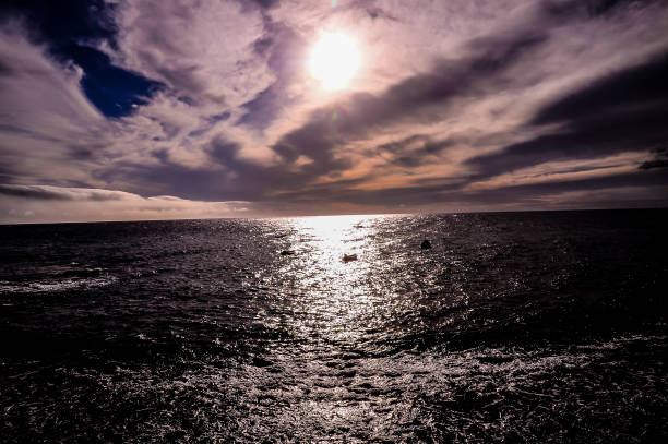 istock The sun is shining on the ocean, creating a beautiful and serene scene 2177582029