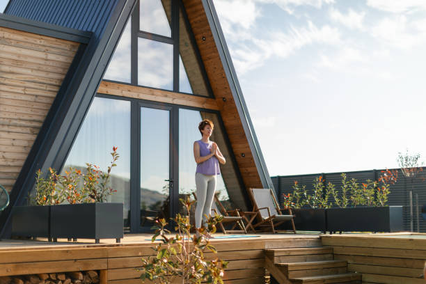 istock Woman doing yoga on patio 2177586860