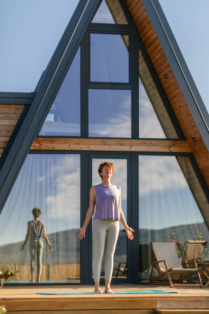 istock Woman doing yoga on patio 2177586878