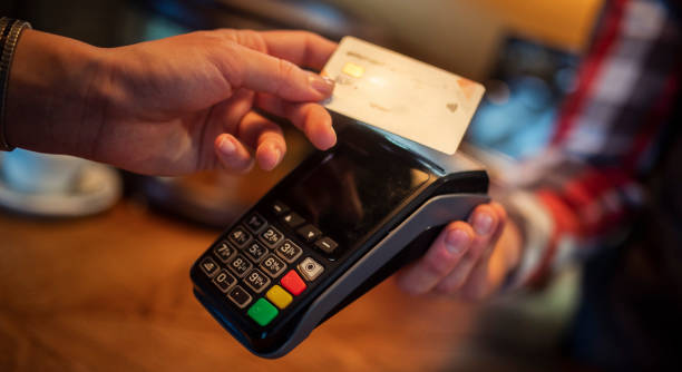 istock A female client pays a restaurant bill by credit card without co 2177587646