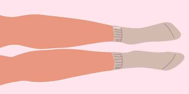 Flat vector illustration of legs lying on the floor in parallel. The lilac socks with elastic band are on the feets. Flat vector illustration of legs lying on the floor in parallel. The lilac socks with elastic band are on the feets. Vector icon isolated on peaches background. Up view. woman feet bed stock illustrations