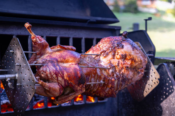 istock Roasting pork and turkey on spit 2177588119