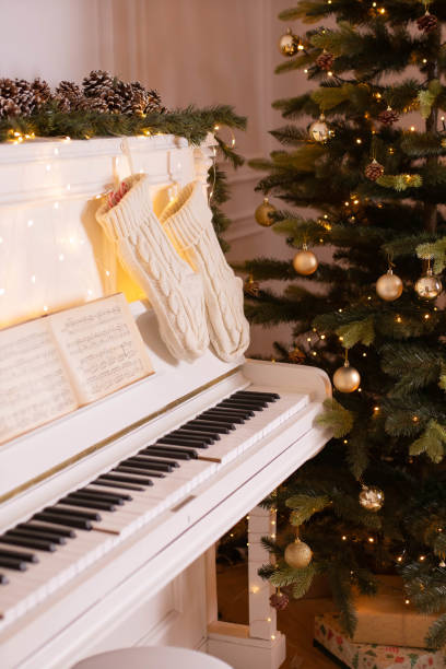 istock Festive Christmas Scene with White Piano and Holiday Tree 2177590661