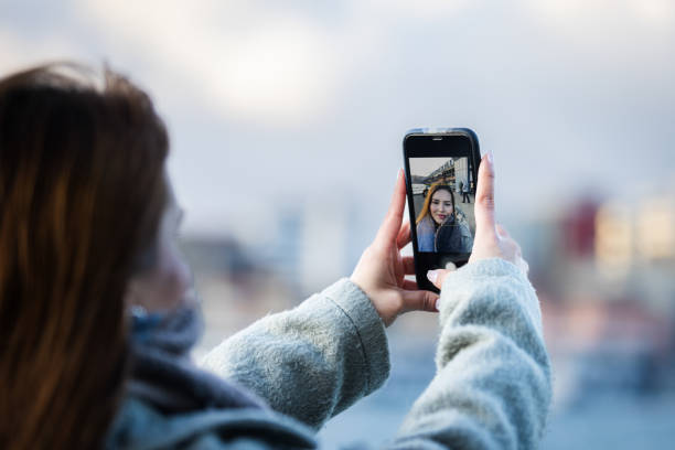 istock Young woman is taking a selfie on the outside. 2177592923